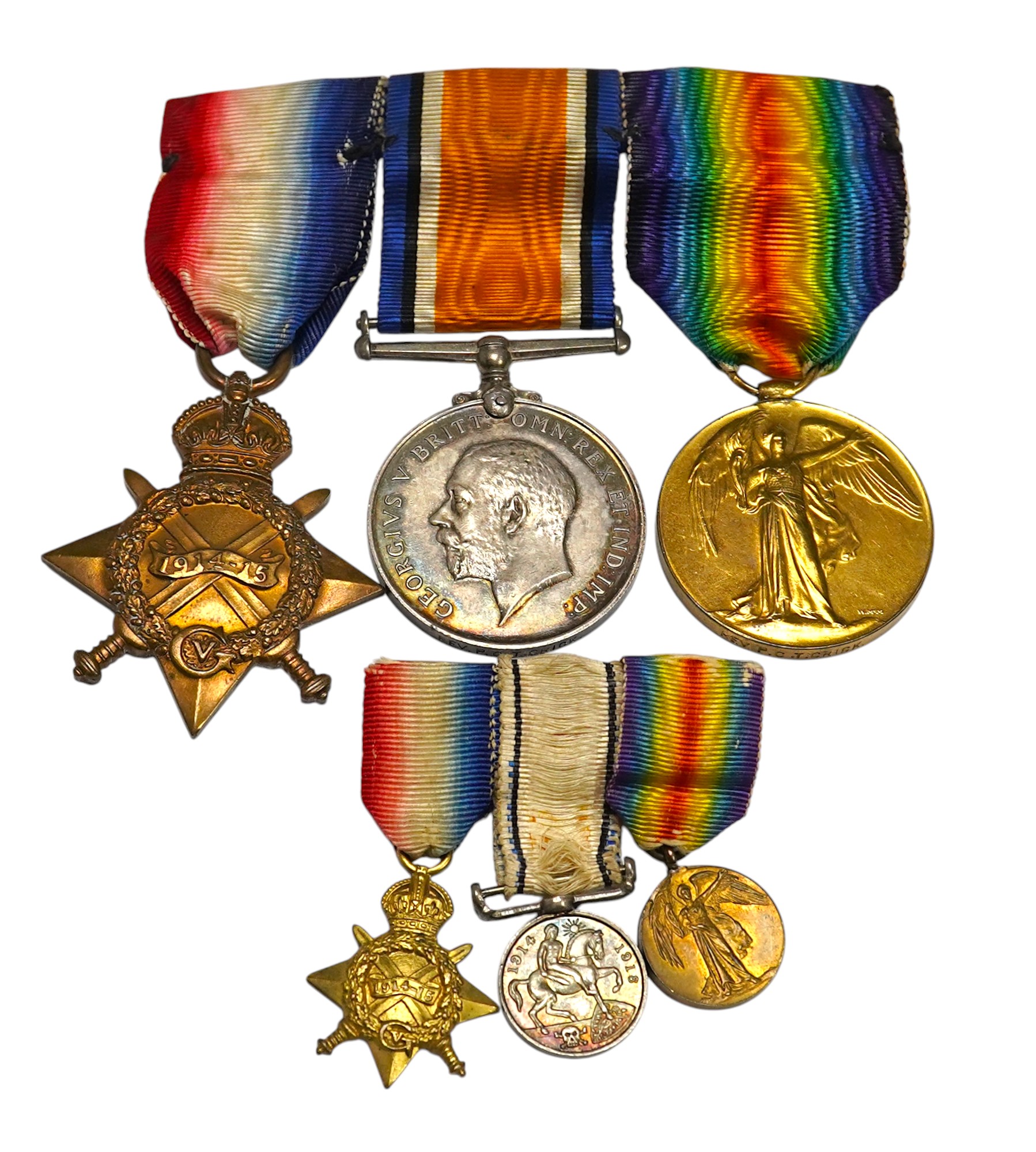 A First World War medal trio awarded to the Rev. P.C.T. Crick A.C.D., together with the miniature set. Condition - poor to fair.